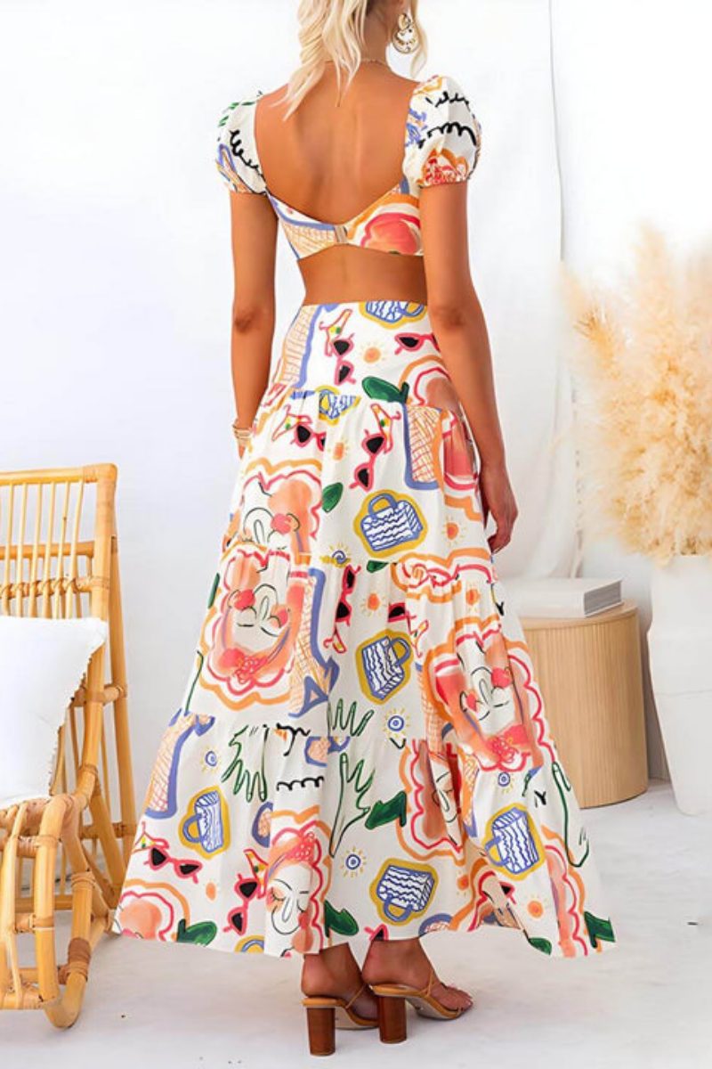 Multicolor - Women's two-piece maxi dress featuring a crop top with puff sleeves, a ruched bust, and a high-waisted skirt with a thigh-high slit, all in a colourful abstract graphic print.