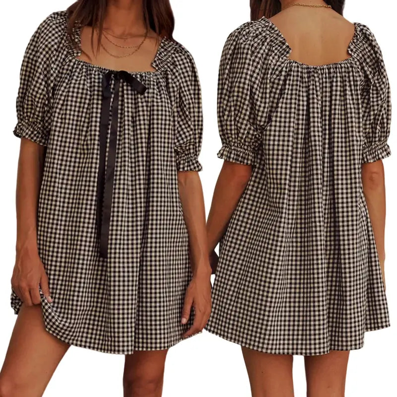 Black - Women's mini-length smock dress in a gingham print, featuring a square neckline with a ribbon tie and short puff sleeves.