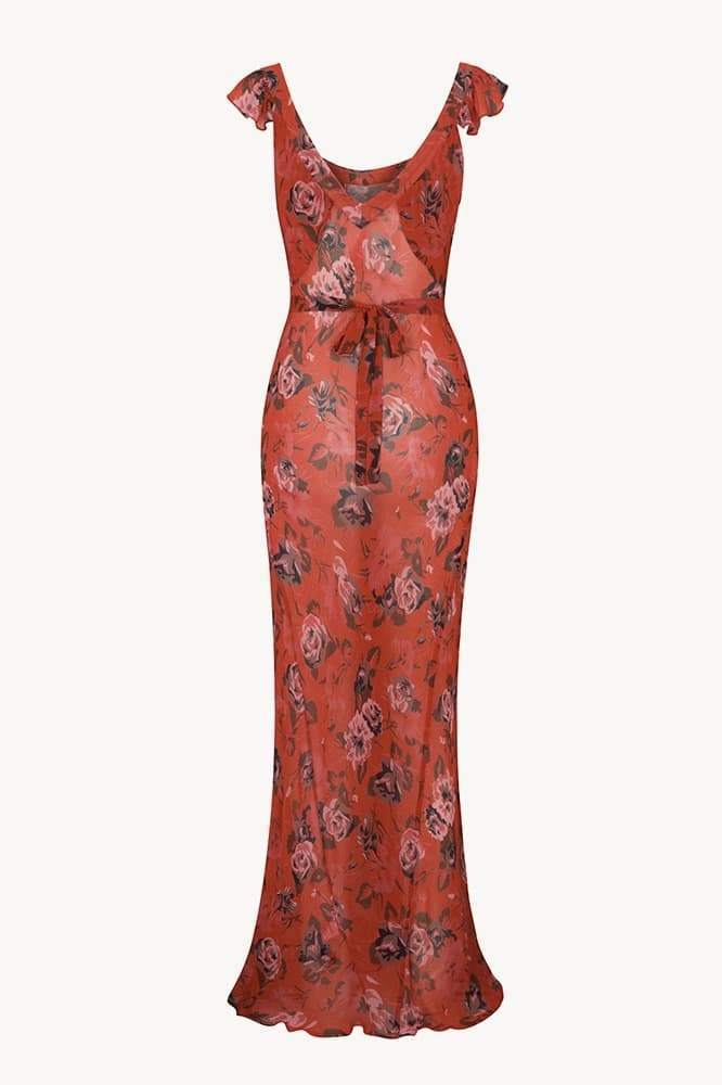 Red - A woman wearing a long, deep red maxi dress with a large pink rose floral print, featuring a scoop neckline and flutter cap sleeves.