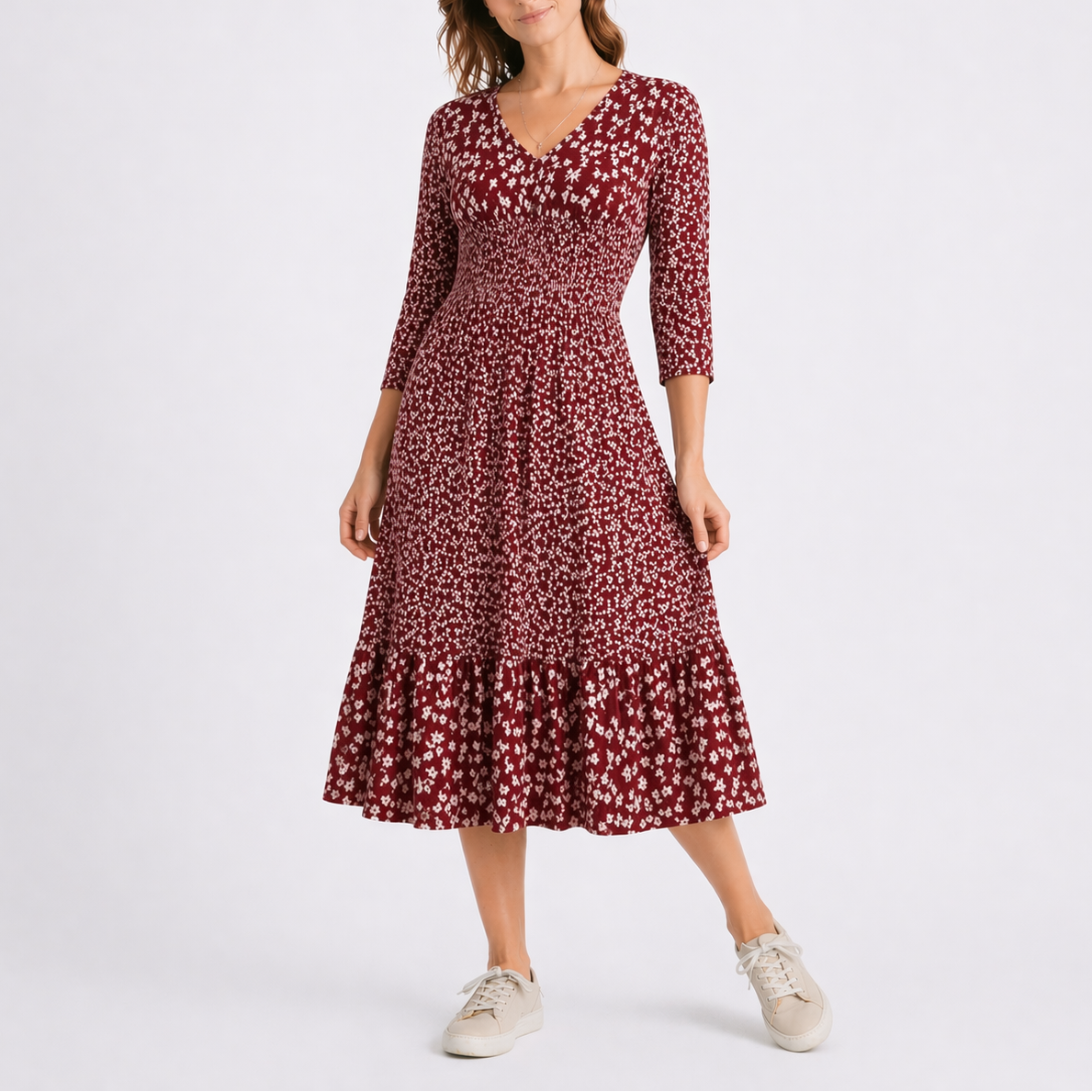 Red - Model wearing a ditsy floral V-neck midi dress with 3/4-length sleeves and a tiered hemline.