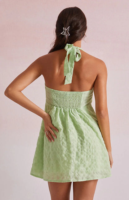 Green - Women's light pink mini dress featuring a plunging ruched halter neckline, centre tie detail, and a flared skirt in a textured crinkle fabric.