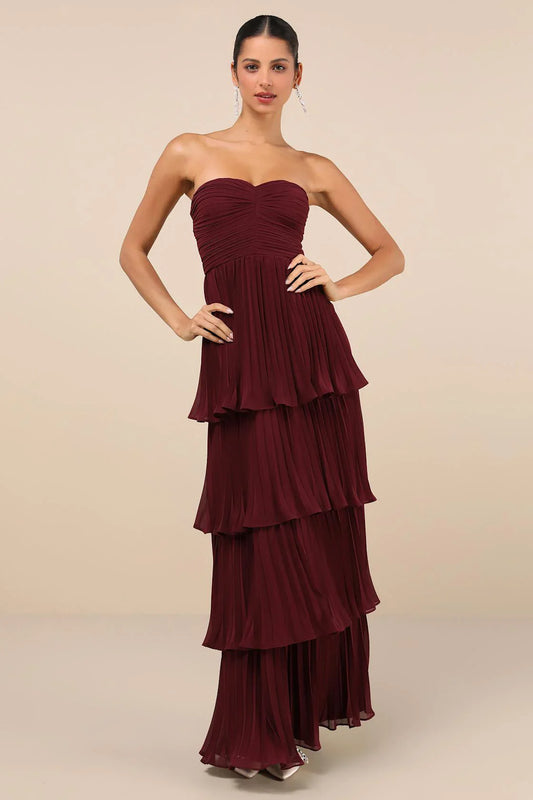 Plum Purple - Women's elegant strapless maxi dress featuring a ruched bodice and a dramatic tiered, pleated skirt.