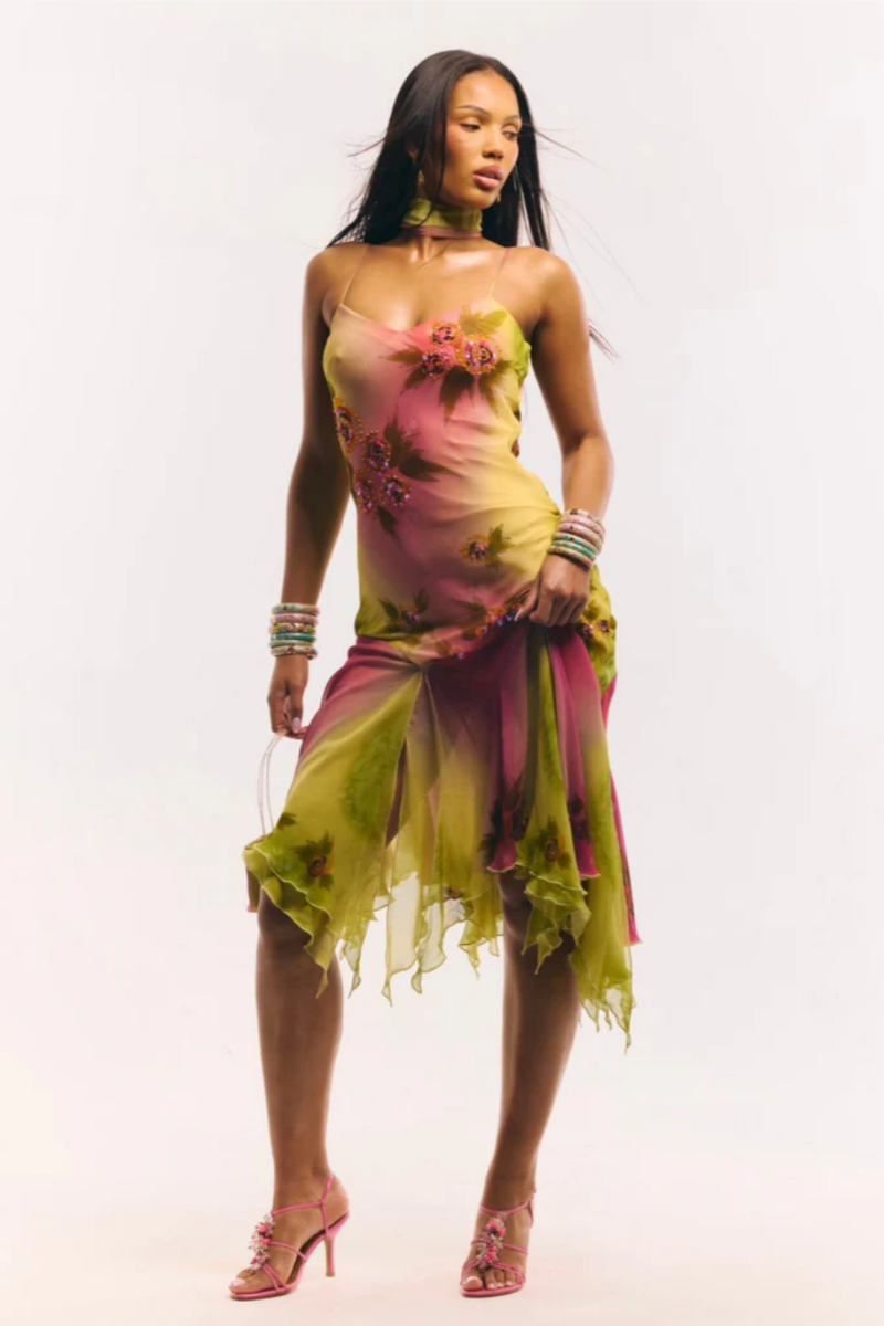 Multicolor - Women's midi-length slip dress featuring a vibrant pink and yellow ombre gradient, scattered floral print, thin straps, and a flowing asymmetrical handkerchief hemline.