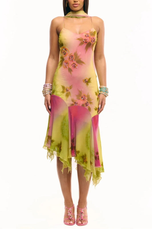 Multicolor - Women's midi-length slip dress featuring a vibrant pink and yellow ombre gradient, scattered floral print, thin straps, and a flowing asymmetrical handkerchief hemline.