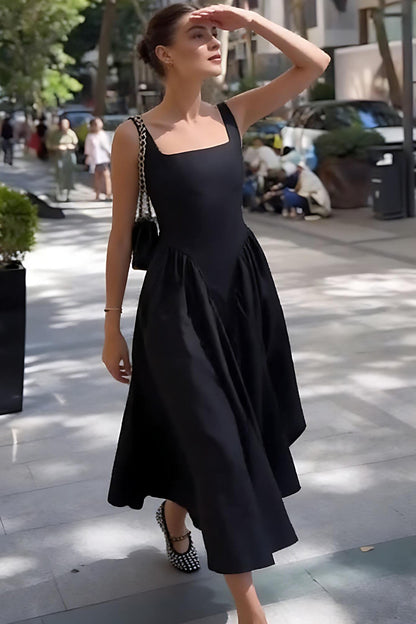 Black - A woman walking outdoors wearing an elegant black sleeveless midi dress featuring a square neckline, fitted bodice, and a full gathered skirt with a dropped waist.