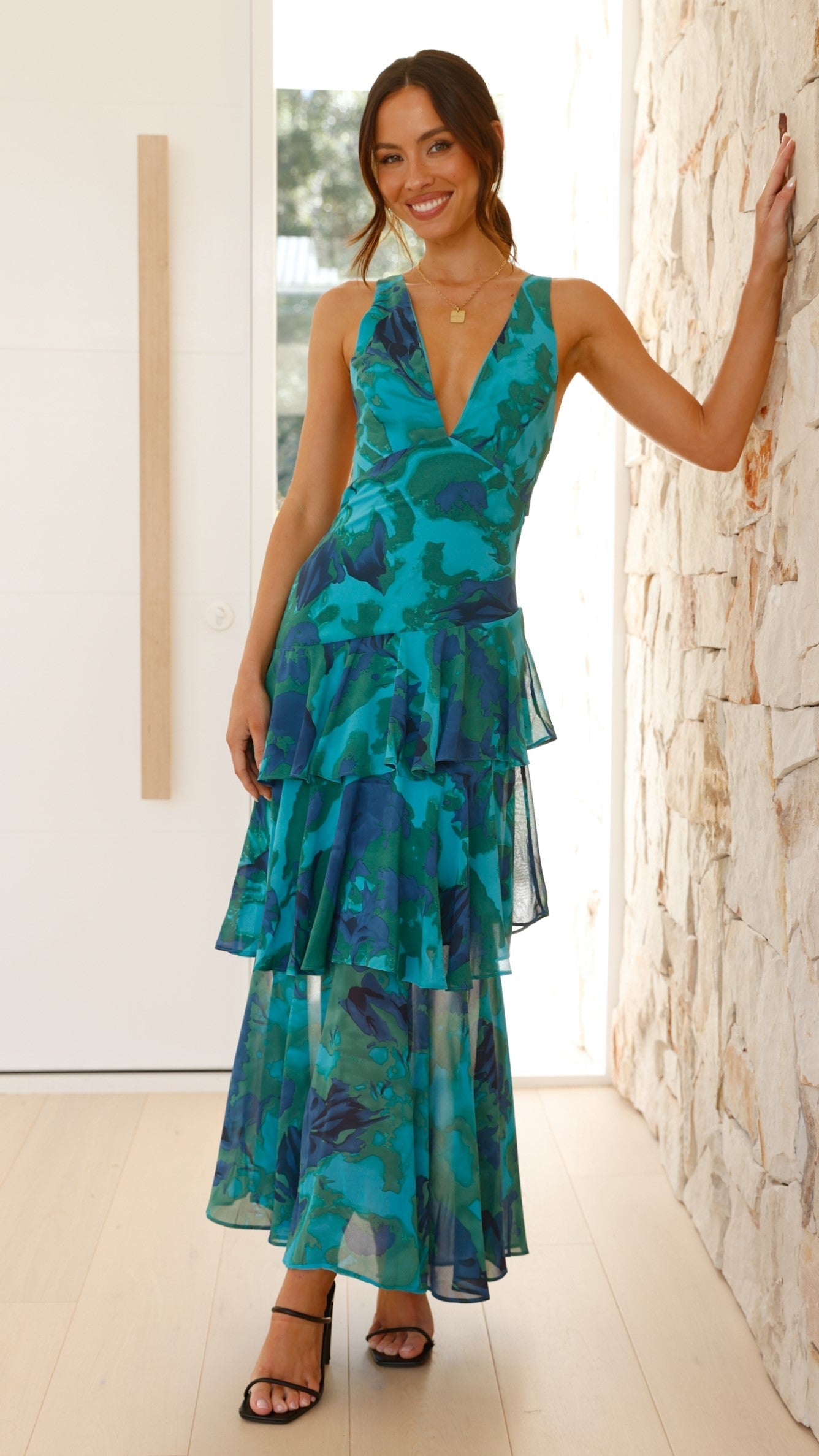 XXL - Women's elegant sleeveless maxi dress featuring a deep plunge neckline, dramatic tiered ruffle skirt, and a bold pink and red large-scale floral print.