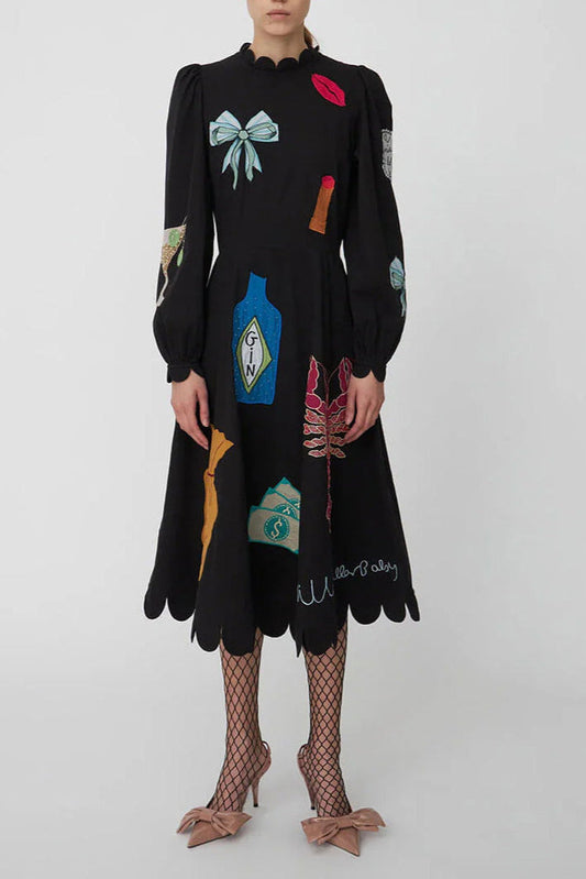 Women's long-sleeve black midi dress featuring colourful novelty appliqués, a scalloped high neckline, scalloped cuffs, and a scalloped hemline.