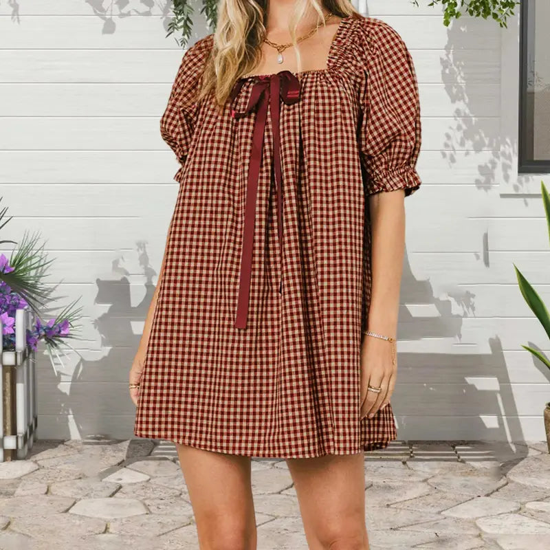 Red - Women's mini-length smock dress in a gingham print, featuring a square neckline with a ribbon tie and short puff sleeves.