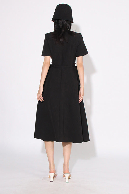 Black - A woman wearing a bright red, short-sleeved midi dress featuring a notched V-neckline, a thin waist belt, and two large 3D rosette embellishments on the A-line skirt.