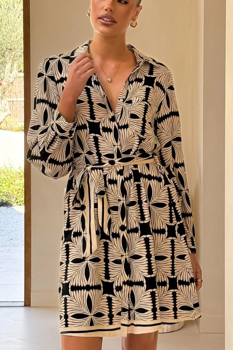 Multicolor - Women's long-sleeve mini shirt dress featuring a vibrant nautical seashell print on a light background, complete with a contrasting patterned tie belt and hem border.