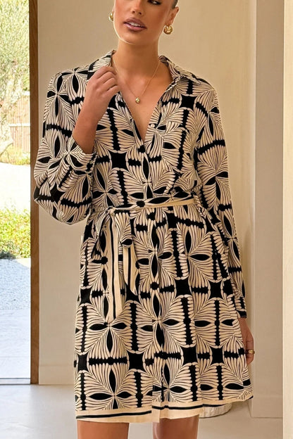 Multicolor - Women's long-sleeve mini shirt dress featuring a vibrant nautical seashell print on a light background, complete with a contrasting patterned tie belt and hem border.