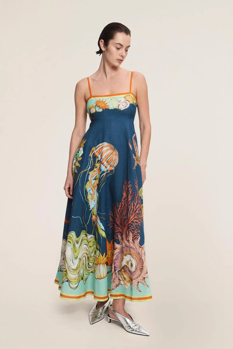 Blue - Women's elegant midi dress featuring a vibrant, large-scale marine and seashell print, styled with delicate spaghetti straps, a square neckline, and a flared A-line skirt with pockets.