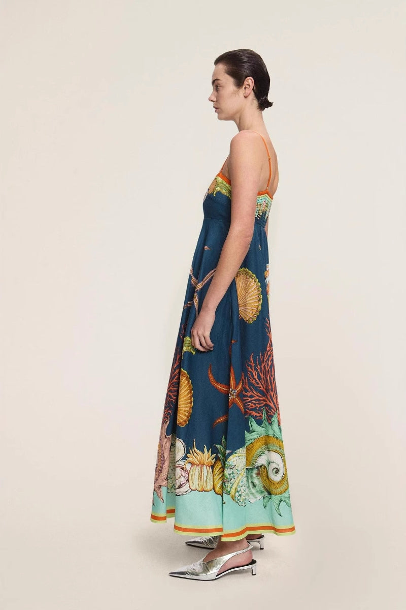 Blue - Women's elegant midi dress featuring a vibrant, large-scale marine and seashell print, styled with delicate spaghetti straps, a square neckline, and a flared A-line skirt with pockets.