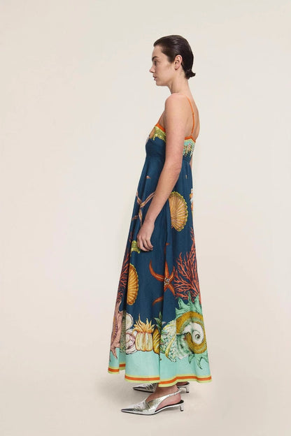 Blue - Women's elegant midi dress featuring a vibrant, large-scale marine and seashell print, styled with delicate spaghetti straps, a square neckline, and a flared A-line skirt with pockets.