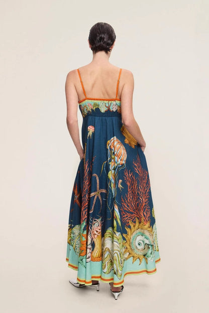 Blue - Women's elegant midi dress featuring a vibrant, large-scale marine and seashell print, styled with delicate spaghetti straps, a square neckline, and a flared A-line skirt with pockets.