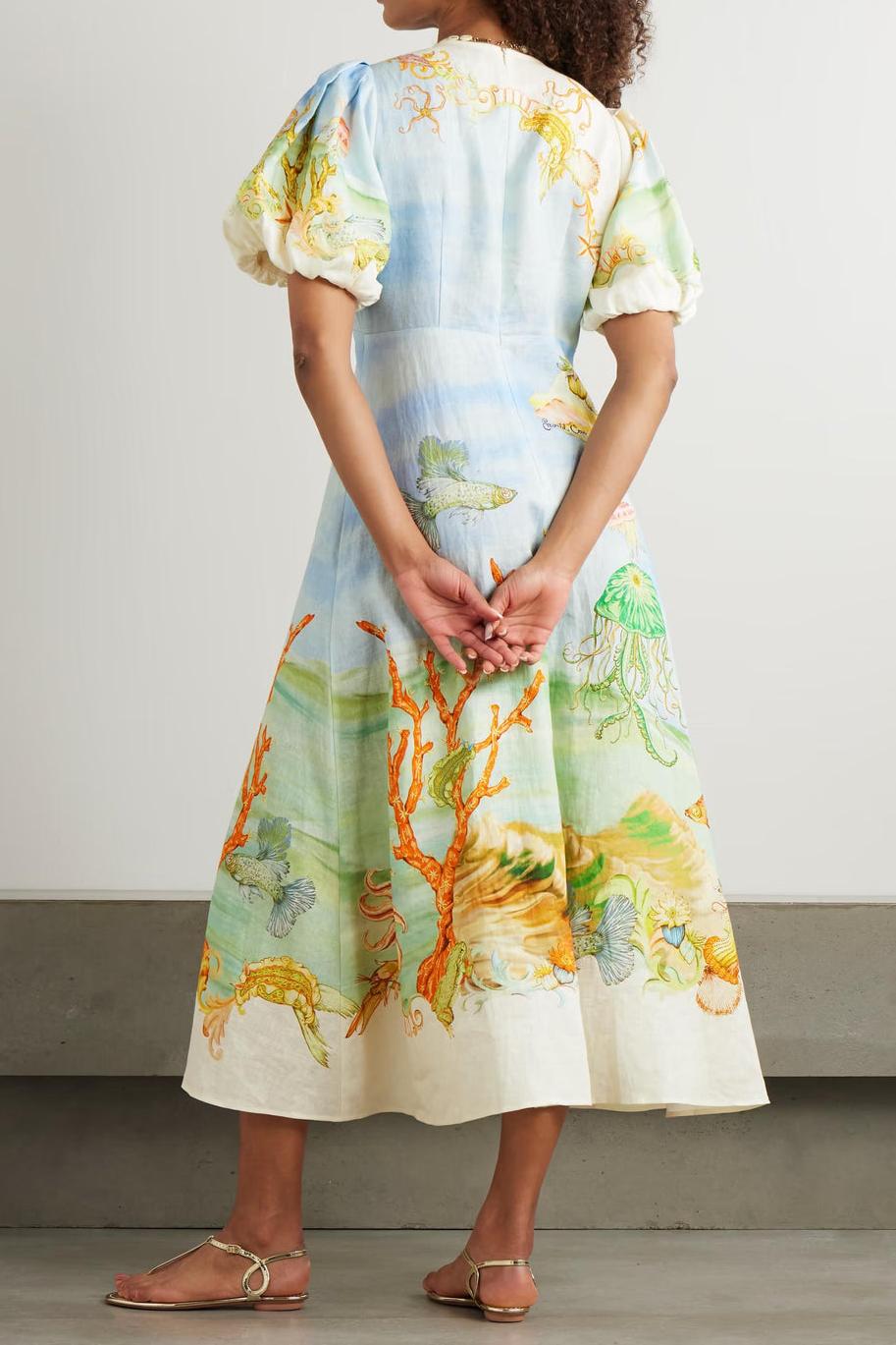 Yellow - Women's midi-length dress with short puff sleeves and a high neckline, featuring a detailed, artistic print of an underwater marine scene with coral, fish, and jellyfish in soft pastel tones.