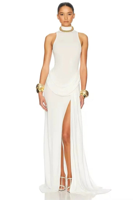 White - A woman wearing an elegant, floor-length white evening dress featuring a high neckline, sleeveless design, draped hip detailing, and a dramatic thigh-high slit.
