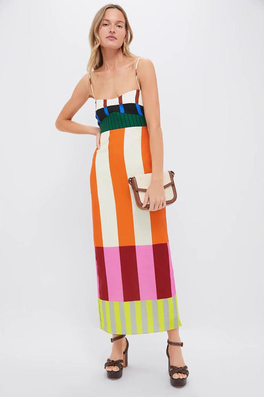 Multi - A woman wearing a vibrant maxi dress with spaghetti straps and a bold, multi-coloured geometric block stripe pattern.
