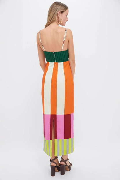 Multi - A woman wearing a vibrant maxi dress with spaghetti straps and a bold, multi-coloured geometric block stripe pattern.
