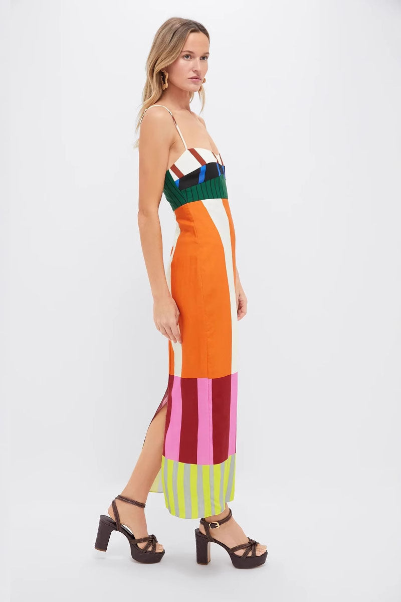 Multi - A woman wearing a vibrant maxi dress with spaghetti straps and a bold, multi-coloured geometric block stripe pattern.