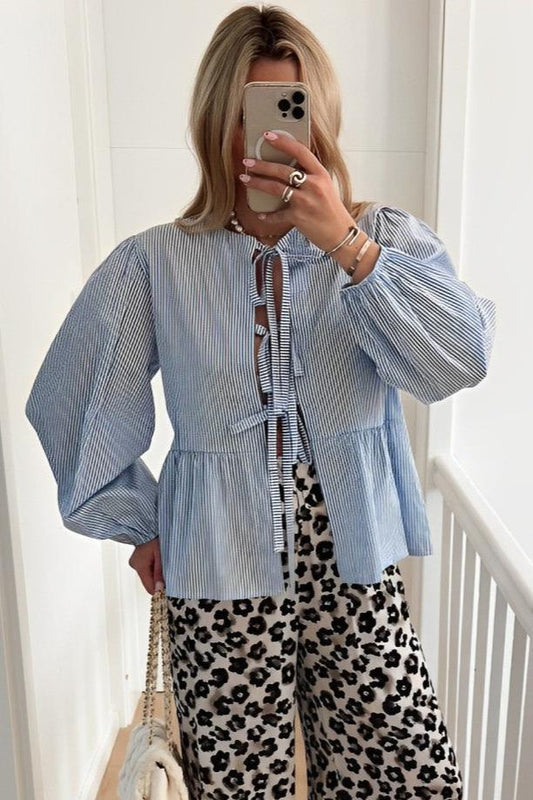 Blue - Women's fine-striped blouse featuring a multi-tie front closure, voluminous long balloon sleeves, and a gathered peplum hem.