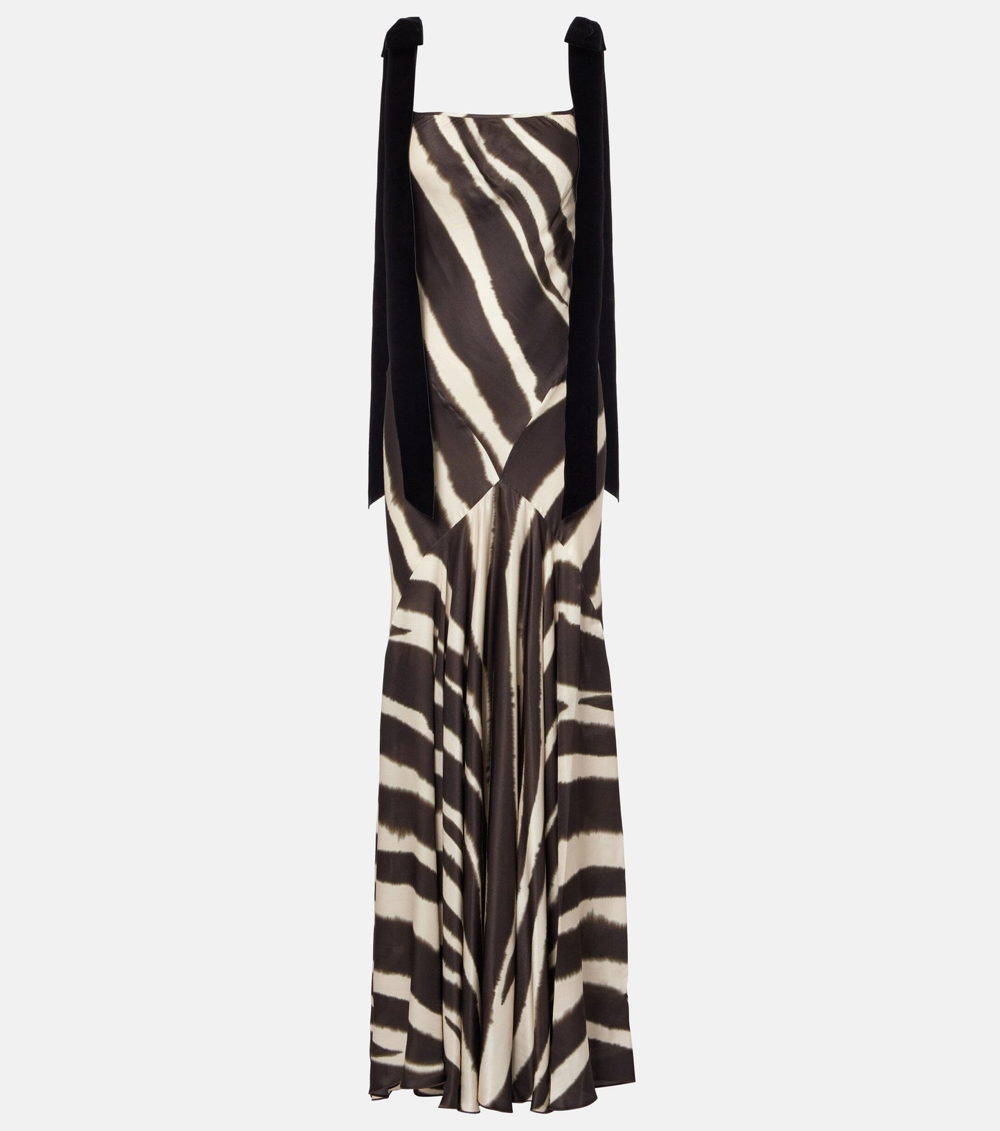 A woman modelling a floor-length, satin-look maxi dress featuring a bold, blurred zebra print and contrasting black textured shoulder ties.