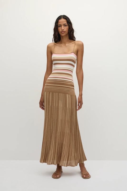 Multi - A woman modelling a long maxi dress with thin spaghetti straps, featuring a horizontally striped, form-fitting bodice that drops into a finely pleated, flowing skirt.