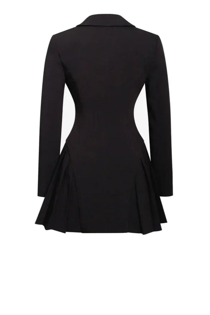 Black - A woman wearing a tailored black long-sleeved mini blazer dress with a deep V-neck, silver statement buttons, and a pleated skirt hem.