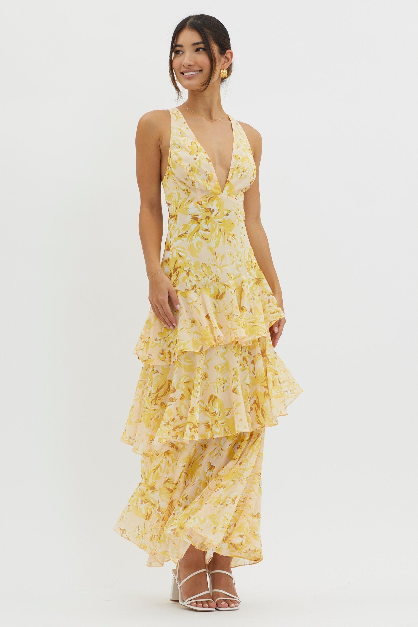 XXL - Women's elegant sleeveless maxi dress featuring a deep plunge neckline, dramatic tiered ruffle skirt, and a bold pink and red large-scale floral print.