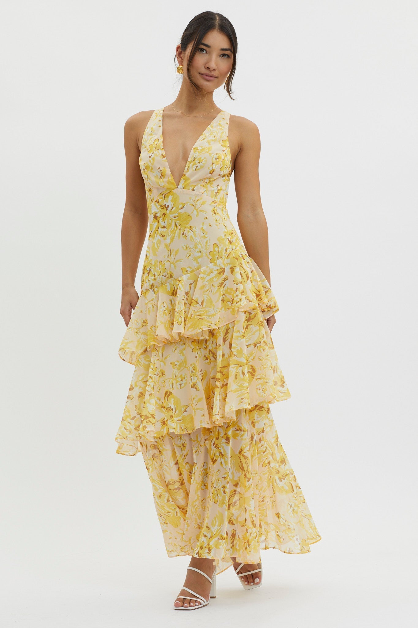 XXL - Women's elegant sleeveless maxi dress featuring a deep plunge neckline, dramatic tiered ruffle skirt, and a bold pink and red large-scale floral print.