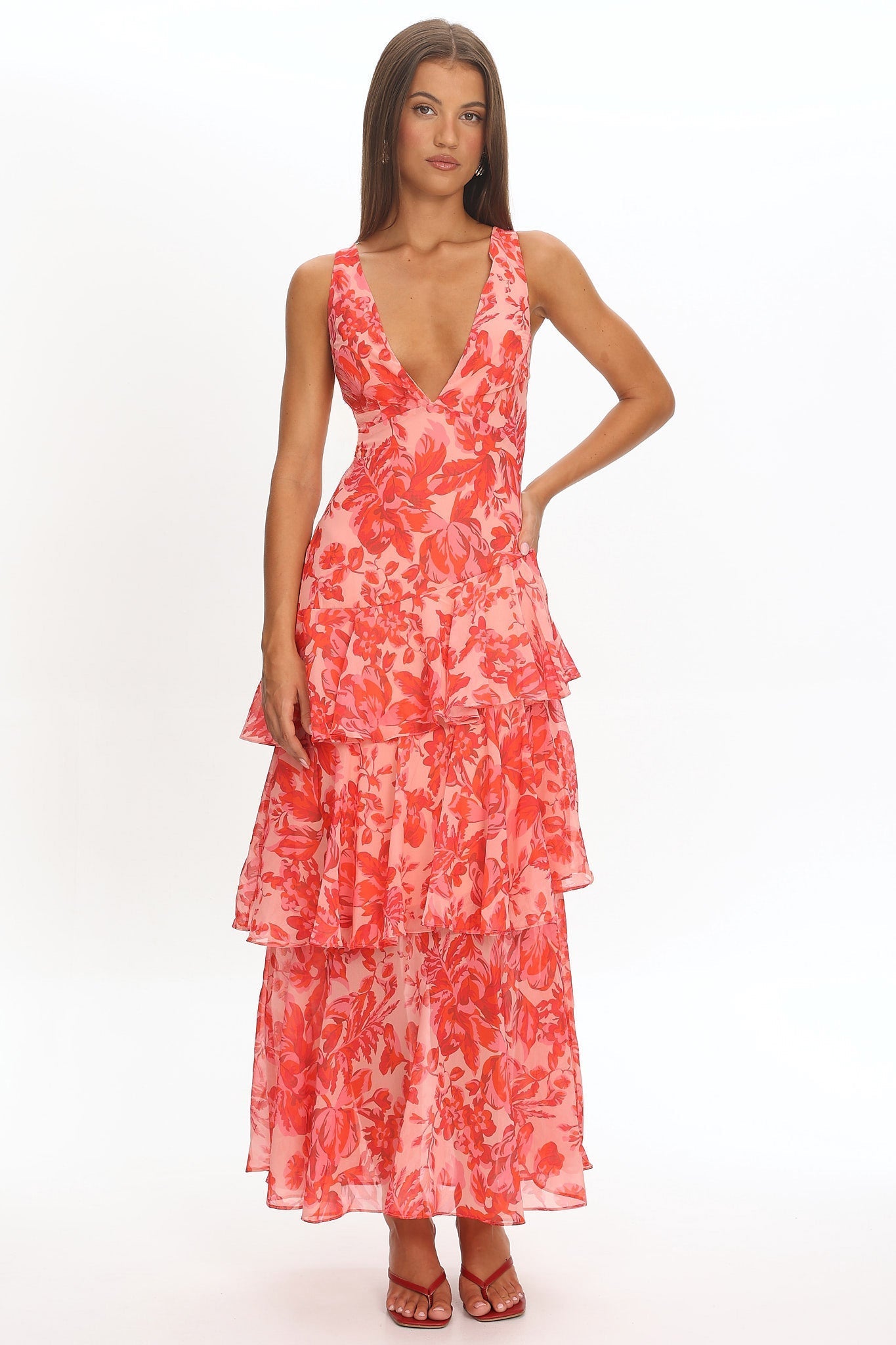 XXL - Women's elegant sleeveless maxi dress featuring a deep plunge neckline, dramatic tiered ruffle skirt, and a bold pink and red large-scale floral print.