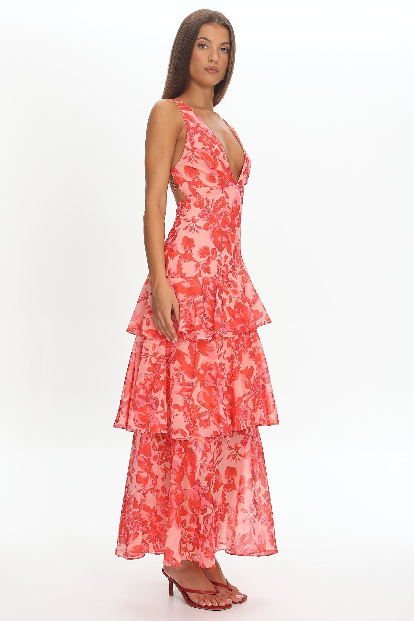 XXL - Women's elegant sleeveless maxi dress featuring a deep plunge neckline, dramatic tiered ruffle skirt, and a bold pink and red large-scale floral print.