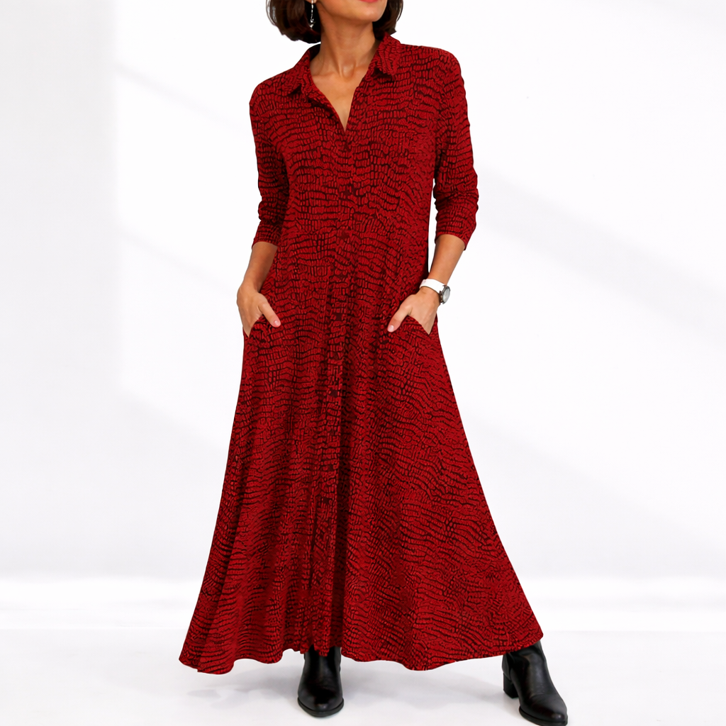 Red - Woman wearing an abstract print collared maxi shirt dress with front buttons and relaxed fit.