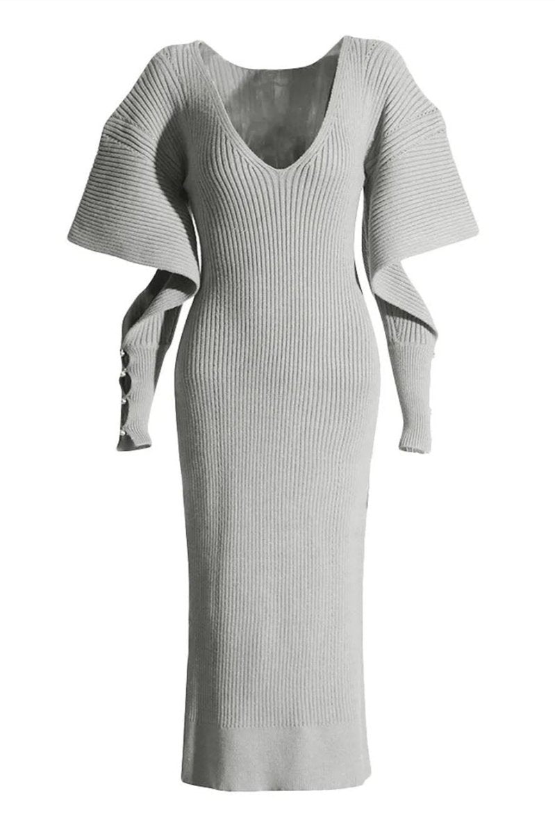 Grey - A woman modeling a cream ribbed knit midi dress with a V-neckline and dramatic split fluted sleeves, holding a brown leather clutch.