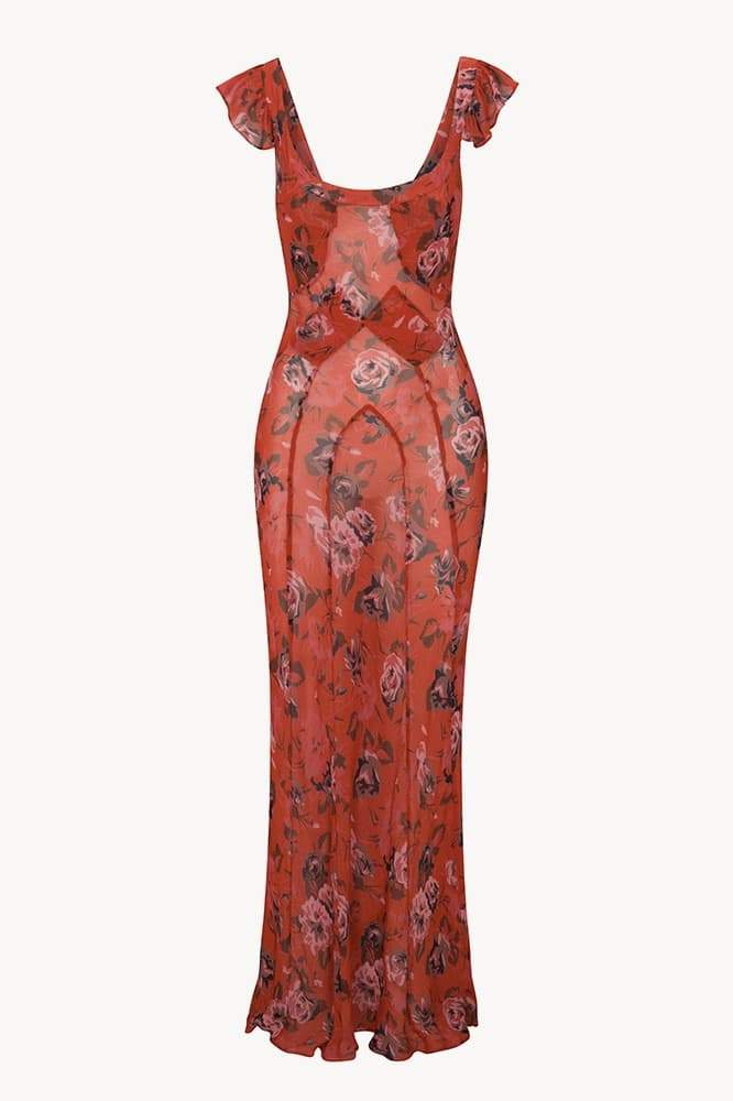 Red - A woman wearing a long, deep red maxi dress with a large pink rose floral print, featuring a scoop neckline and flutter cap sleeves.