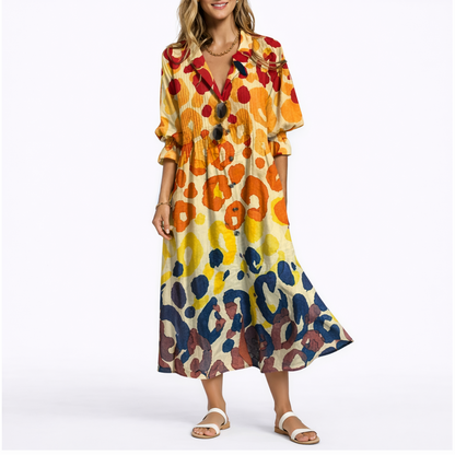 Yellow - Woman wearing a relaxed botanical print midi shirt dress with a collar, front buttons, and 3/4 sleeves.