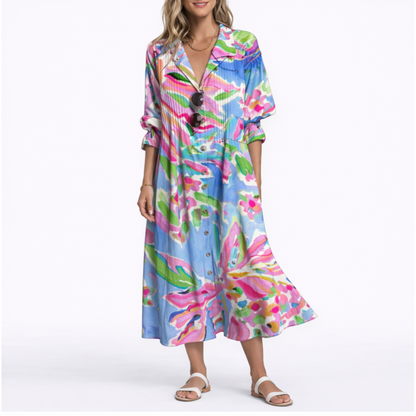 Pink - Woman wearing a relaxed botanical print midi shirt dress with a collar, front buttons, and 3/4 sleeves.