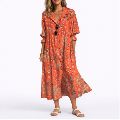 Red - Woman wearing a relaxed botanical print midi shirt dress with a collar, front buttons, and 3/4 sleeves.