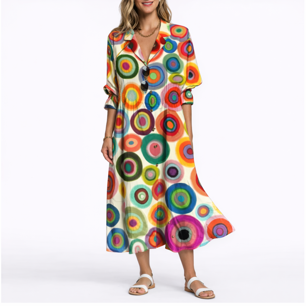 Multicolor - Woman wearing a relaxed botanical print midi shirt dress with a collar, front buttons, and 3/4 sleeves.