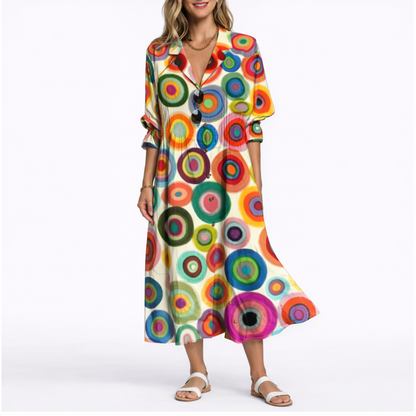 Multicolor - Woman wearing a relaxed botanical print midi shirt dress with a collar, front buttons, and 3/4 sleeves.