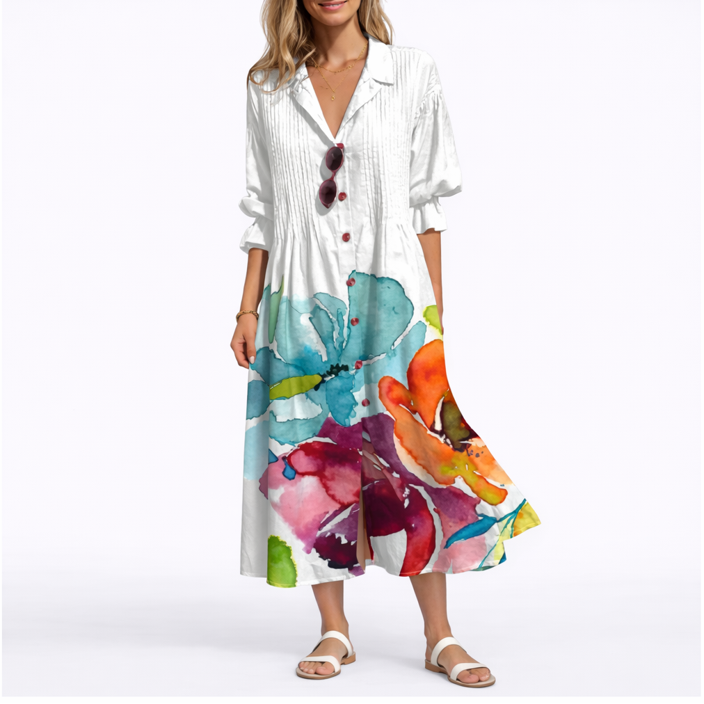 White - Woman wearing a relaxed botanical print midi shirt dress with a collar, front buttons, and 3/4 sleeves.