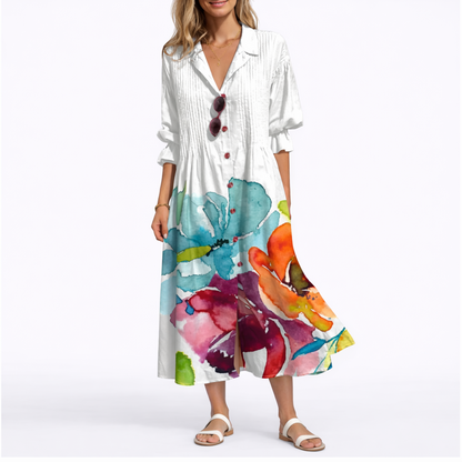 White - Woman wearing a relaxed botanical print midi shirt dress with a collar, front buttons, and 3/4 sleeves.