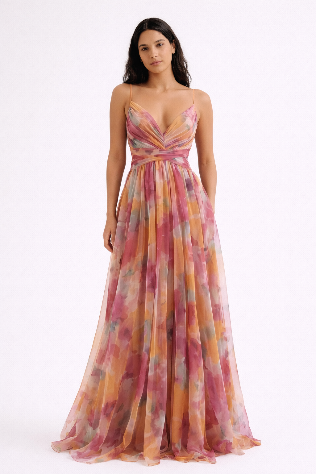 Pink - A woman wearing a flowing, floor-length floral maxi dress with a ruched V-neck bodice and delicate straps.