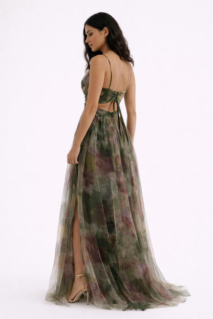 Green - A woman wearing a flowing, floor-length floral maxi dress with a ruched V-neck bodice and delicate straps.