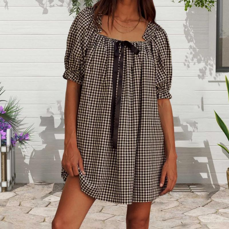Black - Women's mini-length smock dress in a gingham print, featuring a square neckline with a ribbon tie and short puff sleeves.