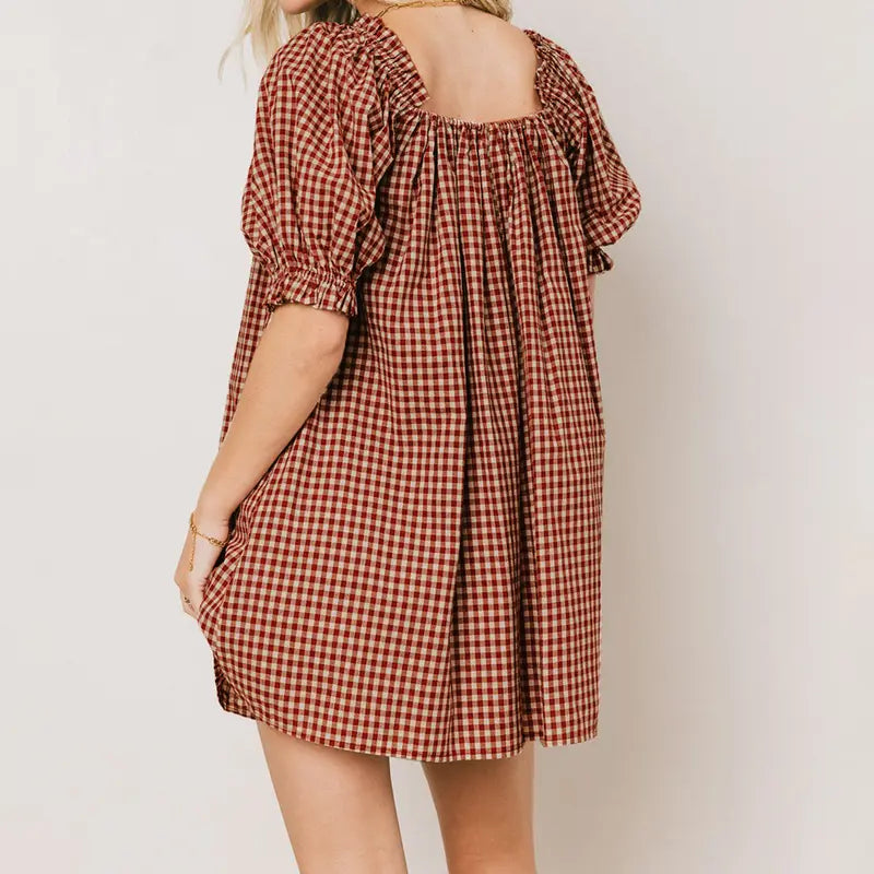Black - Women's mini-length smock dress in a gingham print, featuring a square neckline with a ribbon tie and short puff sleeves.