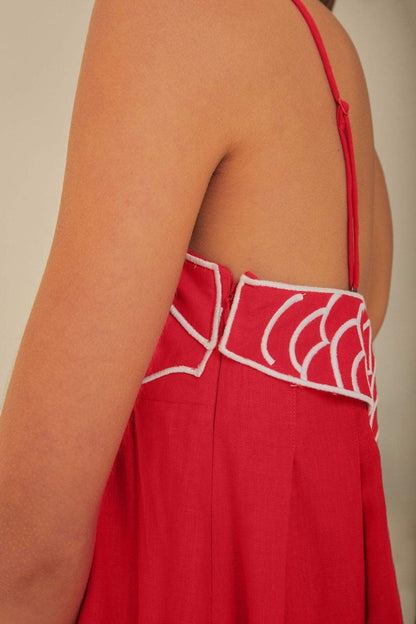 Red - Women's bright red flowing maxi dress featuring delicate spaghetti straps and a unique white embroidered fish design across the bodice.