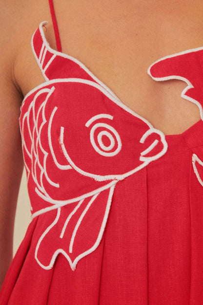 Red - Women's bright red flowing maxi dress featuring delicate spaghetti straps and a unique white embroidered fish design across the bodice.