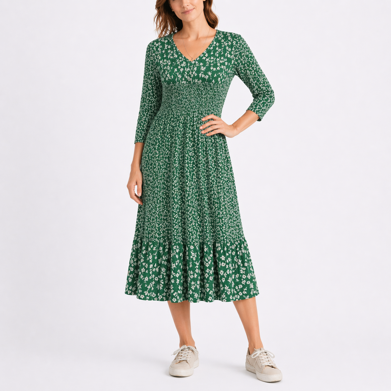 Green - Model wearing a ditsy floral V-neck midi dress with 3/4-length sleeves and a tiered hemline.