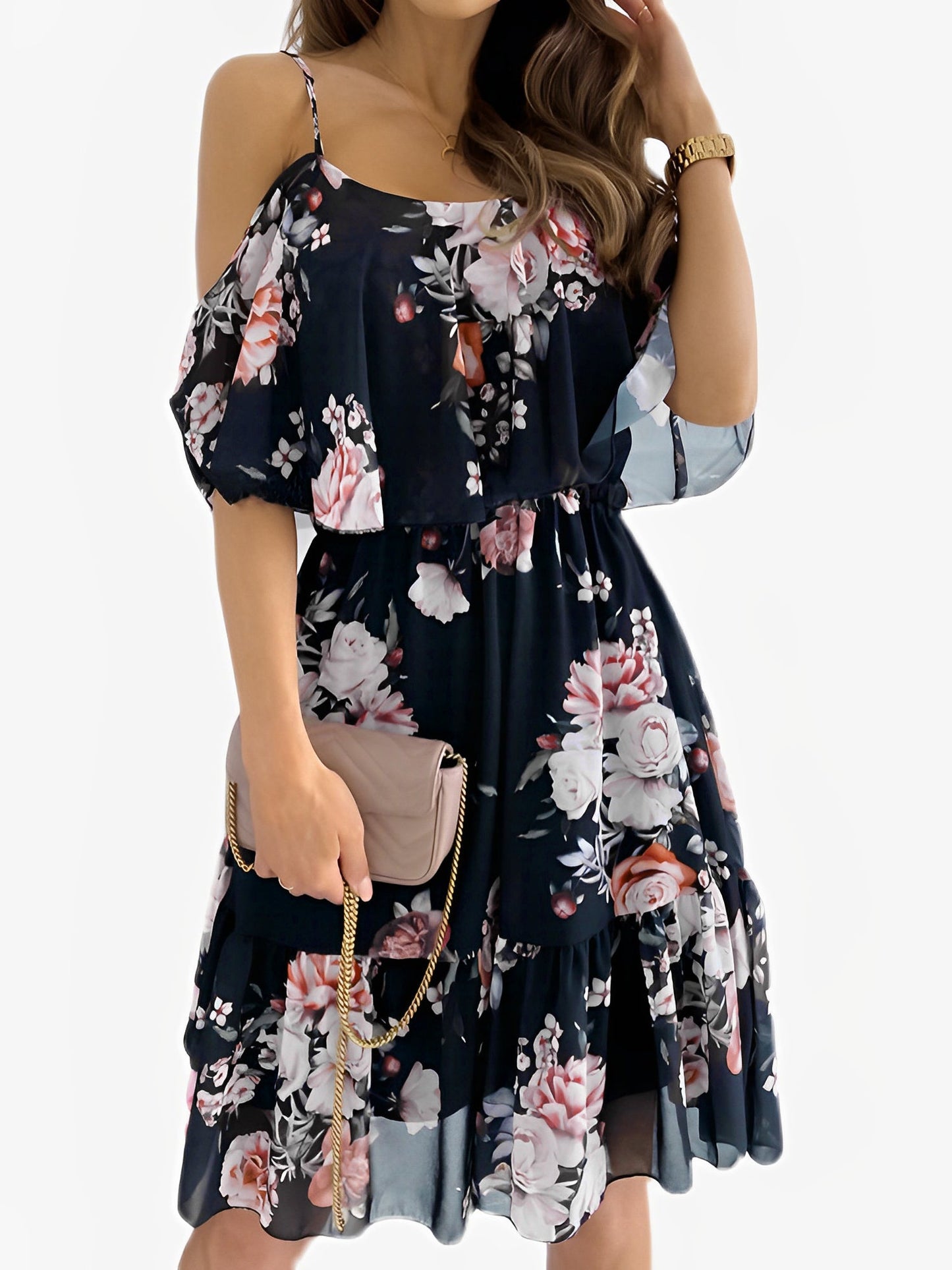 Black - Woman wearing a floral print cold-shoulder tiered dress with a ruffle overlay neckline.